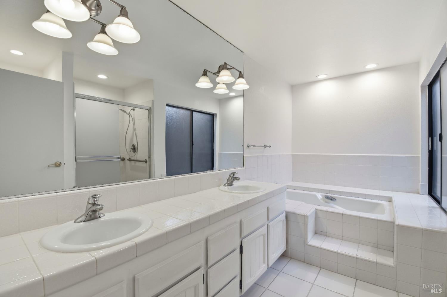 1320 North Street, Unit 7 Santa Rosa, CA 95404 - Photo 18 of 28 a bathroom with a sink a vanity and a mirror