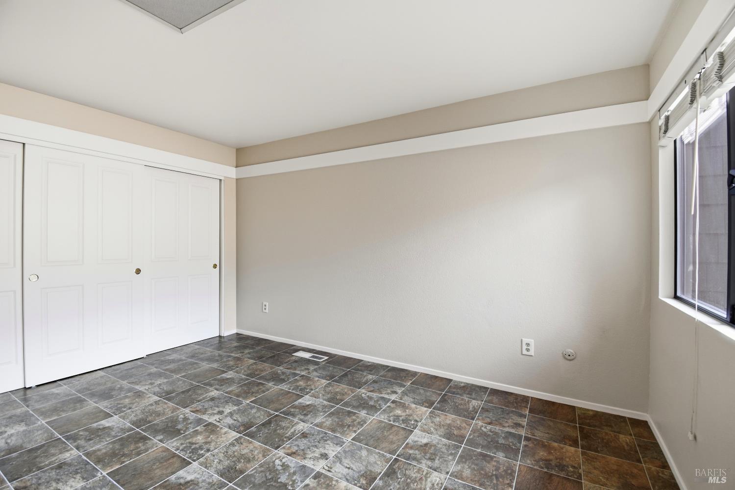 1320 North Street, Unit 7 Santa Rosa, CA 95404 - Photo 20 of 28 a view of a room with a empty space and window