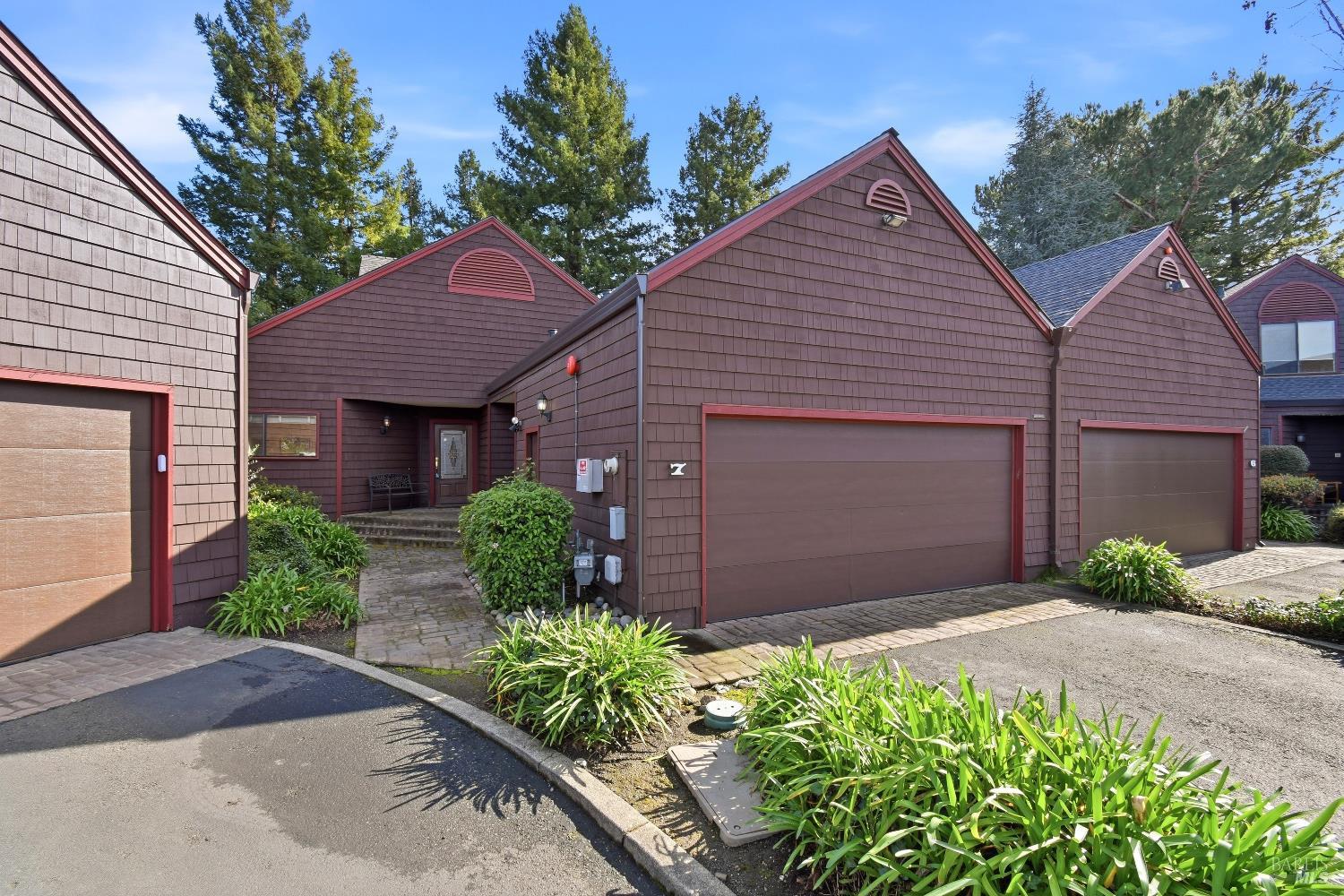 1320 North Street, Unit 7 Santa Rosa, CA 95404 - Photo 2 of 28 a front view of a house with a garden