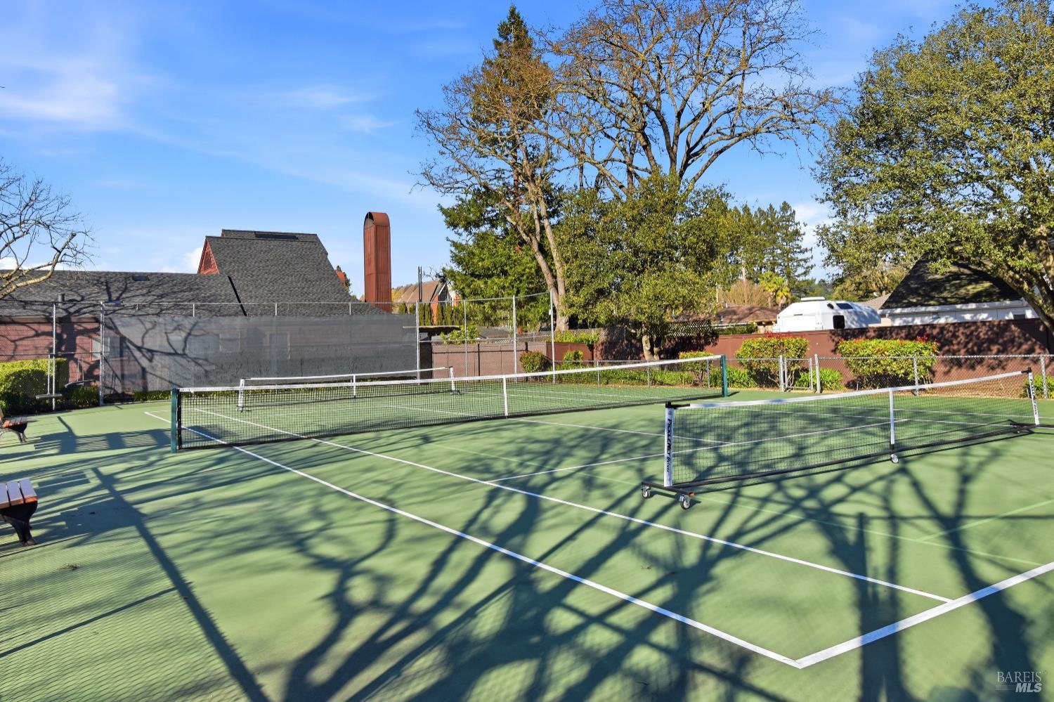 1320 North Street, Unit 7 Santa Rosa, CA 95404 - Photo 28 of 28 a view of a tennis ground with large trees