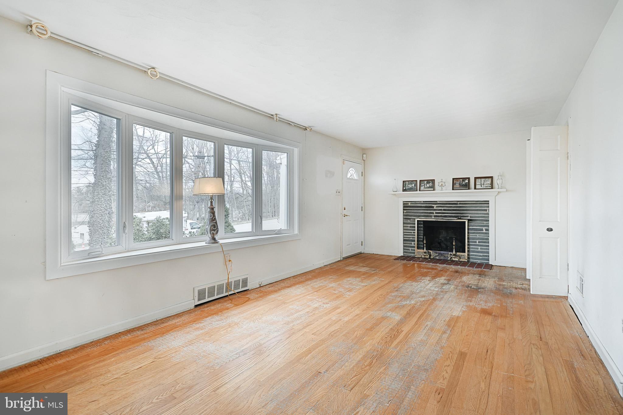 1898 Church Road York, PA 17408 - Photo 5 of 34 Living room w/ original hard wood floors & FP
