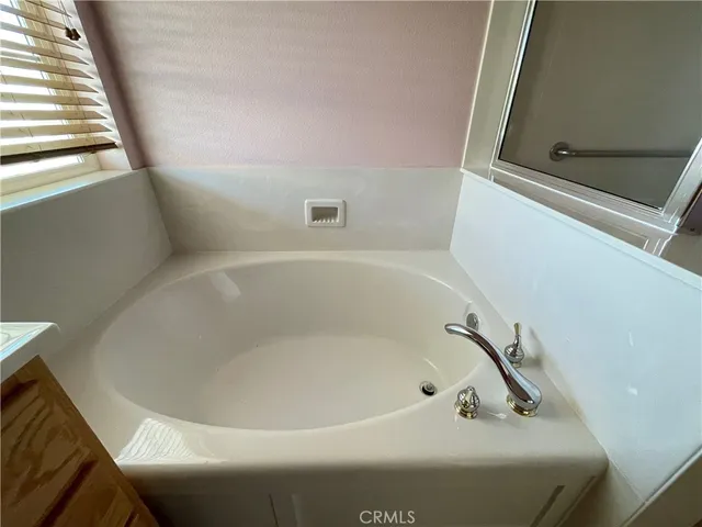 a close up of a bathtub in a bathroom