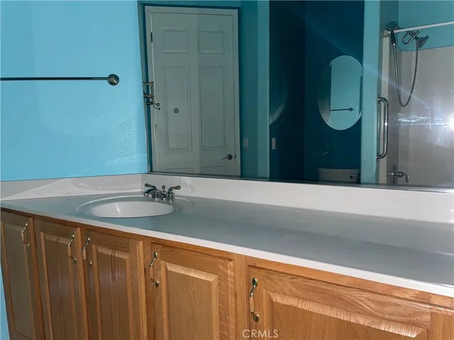 a bathroom with a sink and mirror