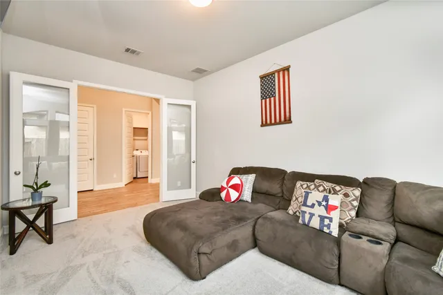a living room with furniture and a window
