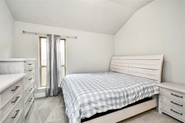 a bedroom with a bed and a cabinets