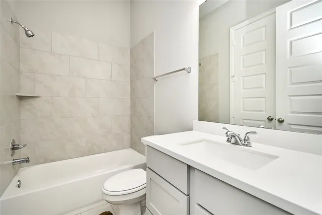 a bathroom with a sink a toilet and a bathtub