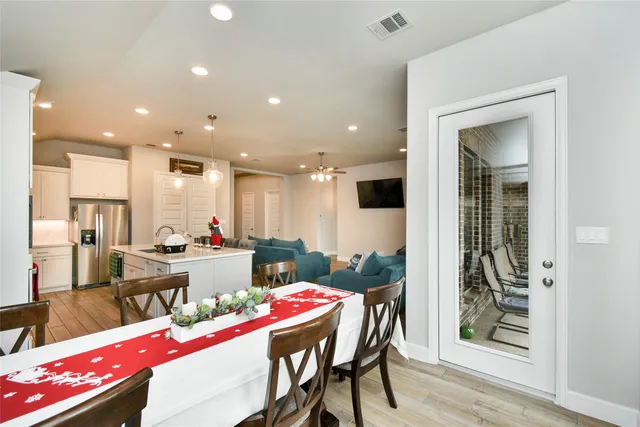 a room with lots of furniture and view of dining room
