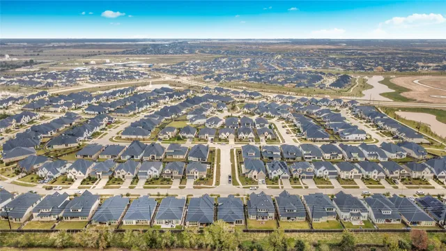 an aerial view of residential building and lake