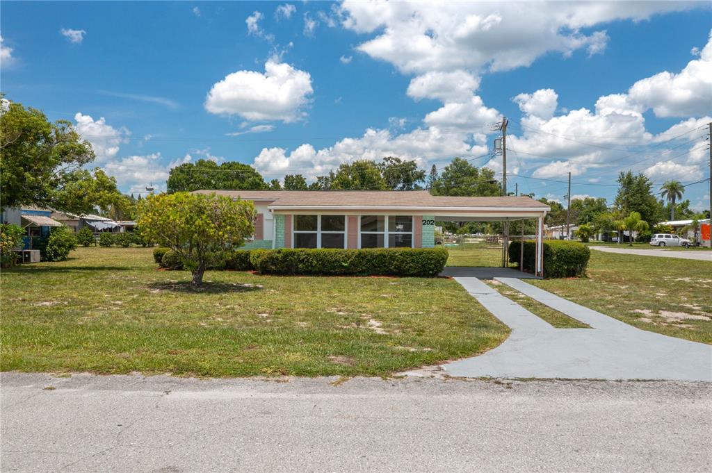 202 Central Avenue Frostproof, FL 33843 - Photo 1 of 1 a front view of a house with a yard