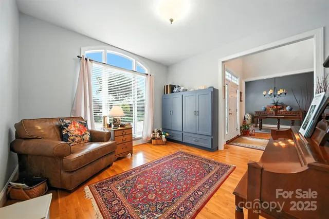 a living room with furniture and a rug