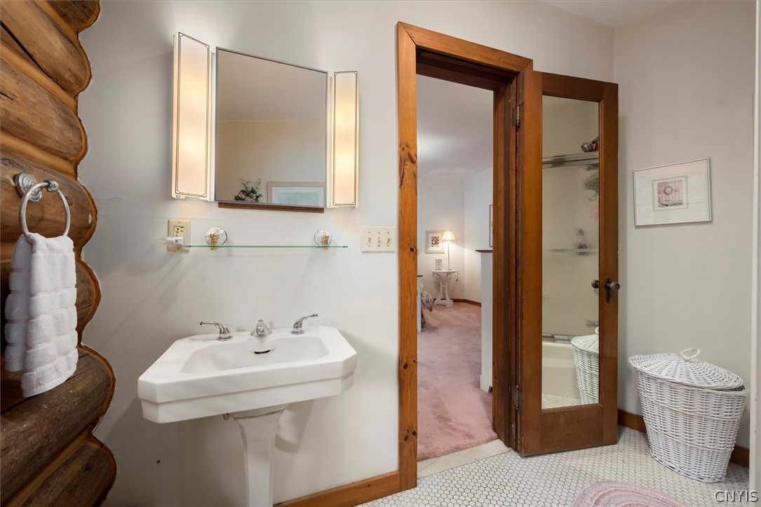 656 Hollywood Road, Unit 15 Webb, NY 13420 - Photo 23 of 50 Full bath with tub/shower attached to bedroom 4