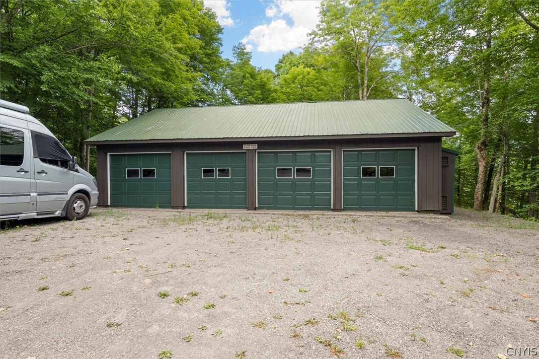 656 Hollywood Road, Unit 15 Webb, NY 13420 - Photo 34 of 50 40 x 30 4 car garage with electricity