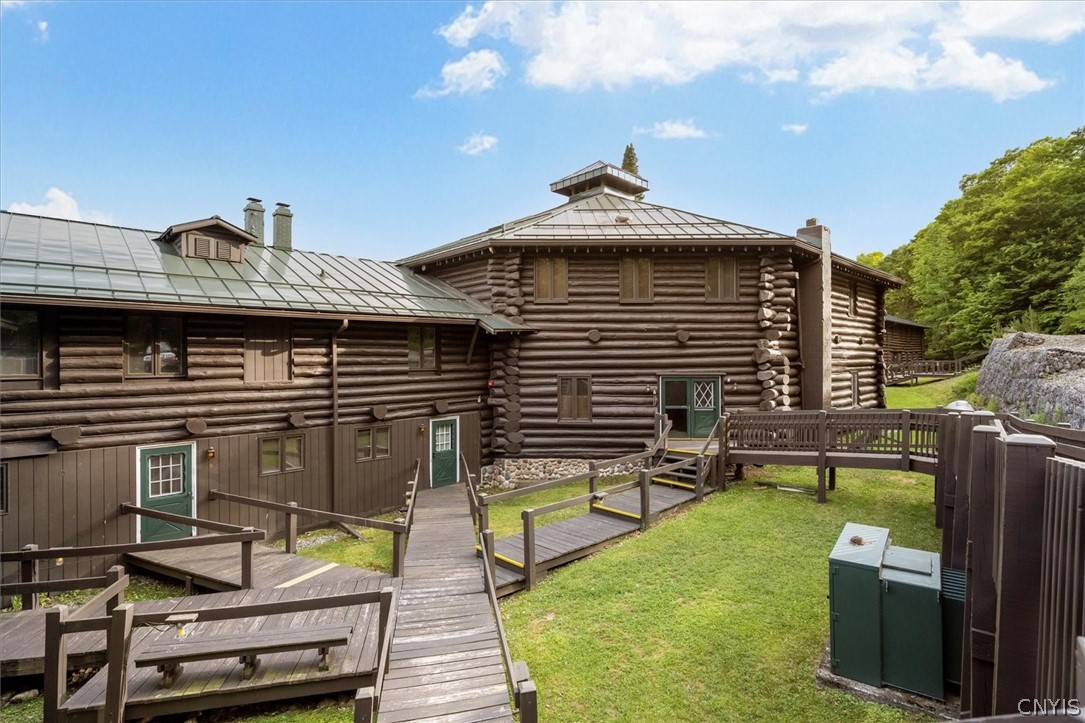 656 Hollywood Road, Unit 15 Webb, NY 13420 - Photo 35 of 50 Entire log exterior had logs chinked and stained s