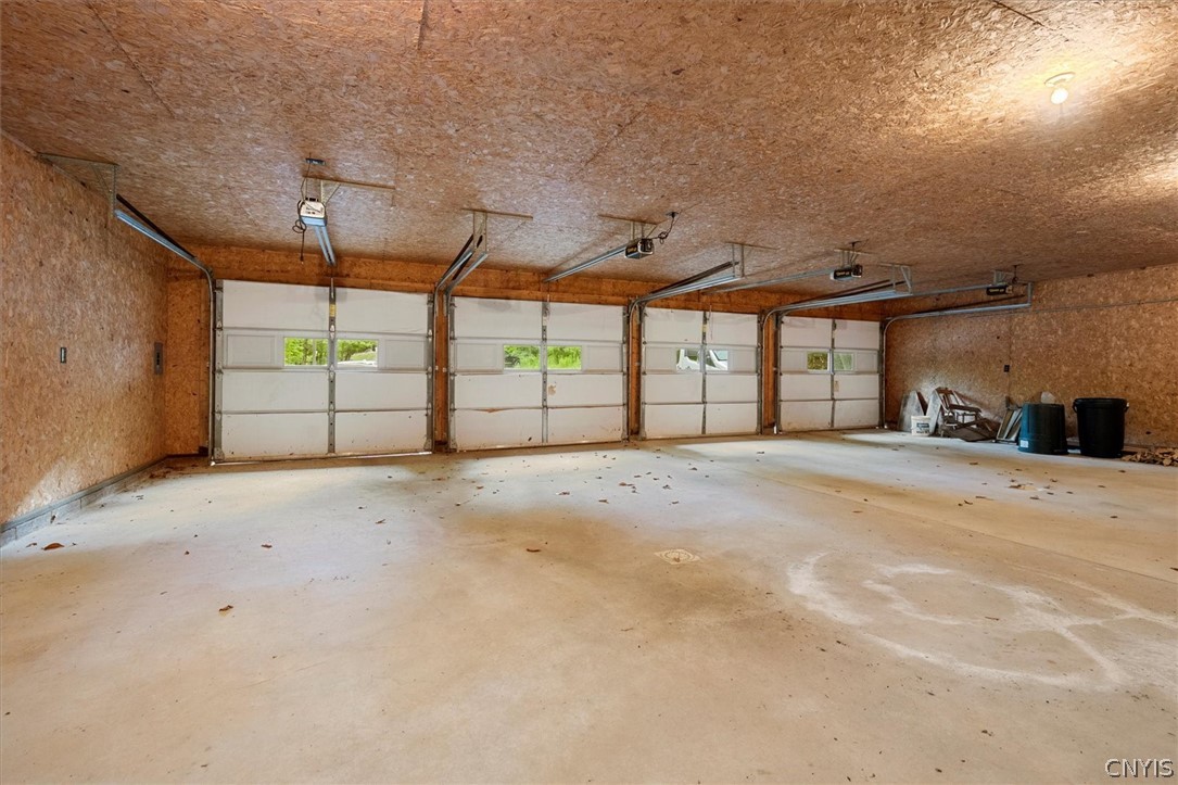 656 Hollywood Road, Unit 15 Webb, NY 13420 - Photo 36 of 50 Garage interior with additional attic space