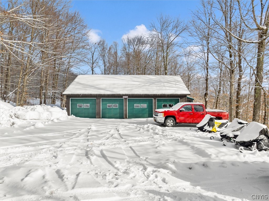 656 Hollywood Road, Unit 15 Webb, NY 13420 - Photo 43 of 50 Spacious 4 car garage and extra overflow parking
