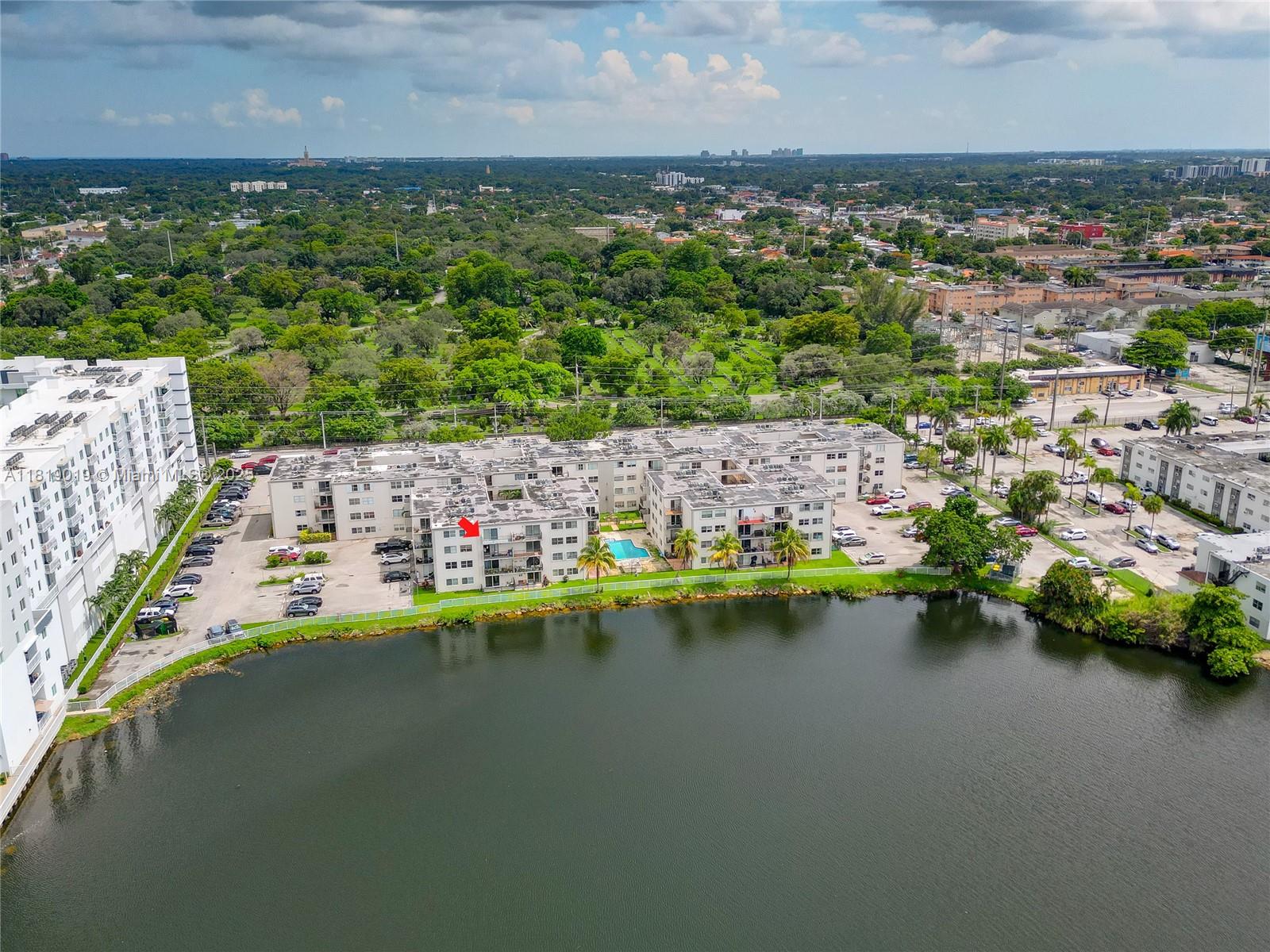 5501 Northwest 7th Street, Unit E408 Miami, FL 33126 - Photo 34 of 35 a view of swimming pool with outdoor space and lake view