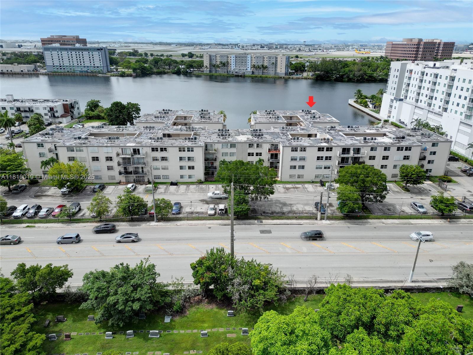 5501 Northwest 7th Street, Unit E408 Miami, FL 33126 - Photo 5 of 35 an aerial view of ocean and residential houses with outdoor space