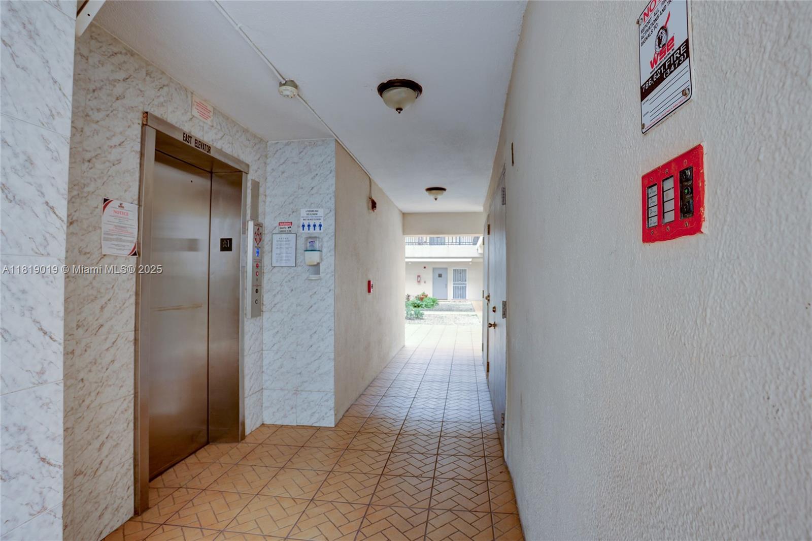 5501 Northwest 7th Street, Unit E408 Miami, FL 33126 - Photo 10 of 35 a view of a hallway
