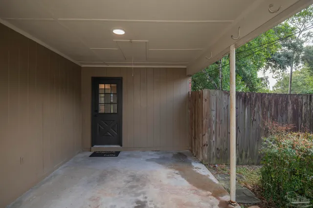 a view of a kitchen with microwave and cabinets