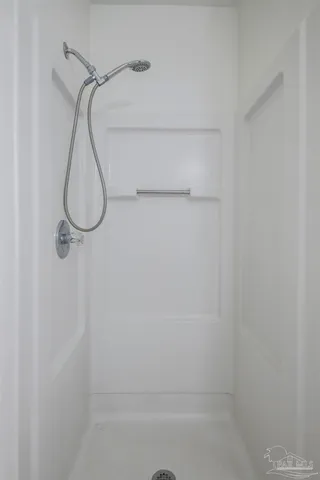 a white toilet sitting next to a bathroom sink