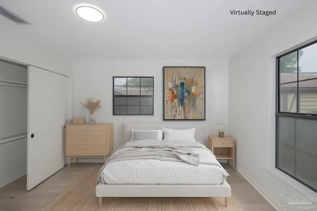 a bathroom with a sink vanity and mirror