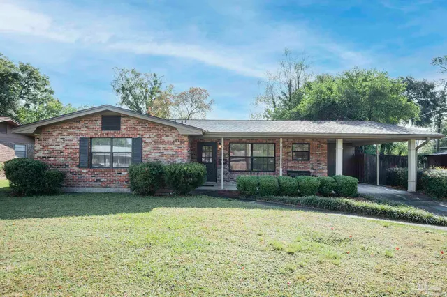 a kitchen with refrigerator a sink and dishwasher a refrigerator with wooden cabinets