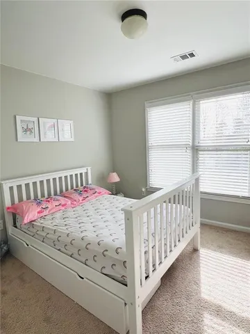 a view of balcony with wooden floor and seating space