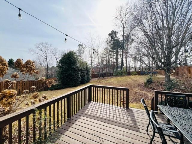 7437 Fireside Lane Flowery Branch, GA 30542 - Photo 14 of 16 a view of balcony with wooden floor and seating space