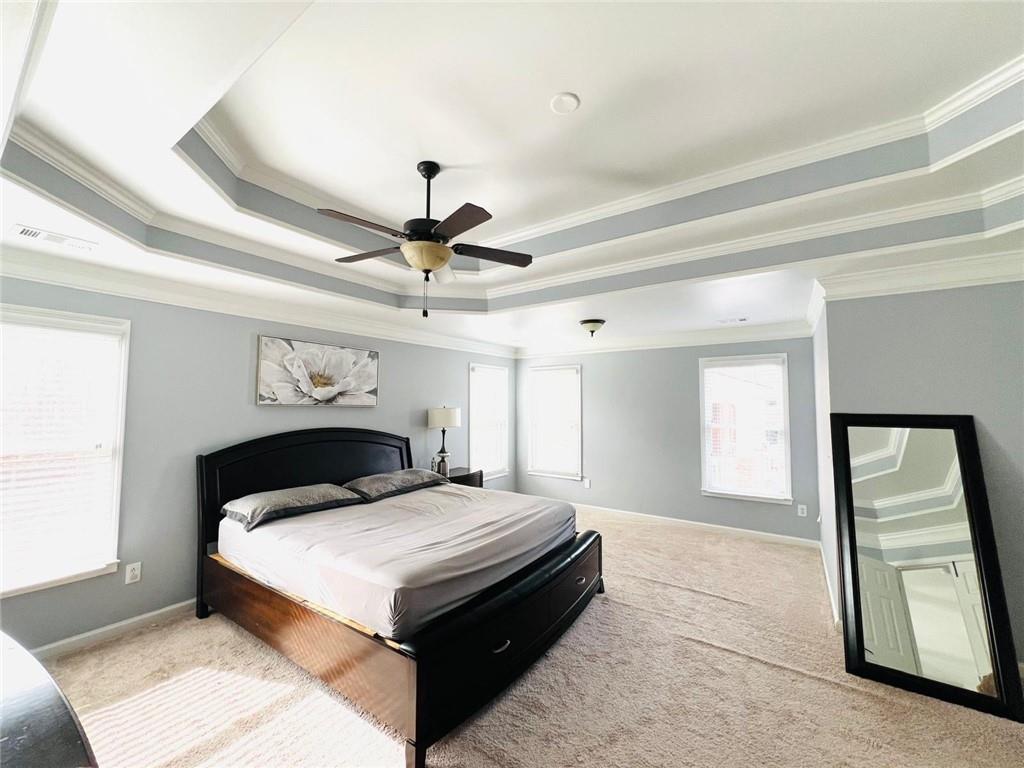 7437 Fireside Lane Flowery Branch, GA 30542 - Photo 15 of 16 a bedroom with a large bed and a window