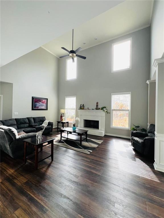 7437 Fireside Lane Flowery Branch, GA 30542 - Photo 6 of 16 a living room with furniture and a fireplace