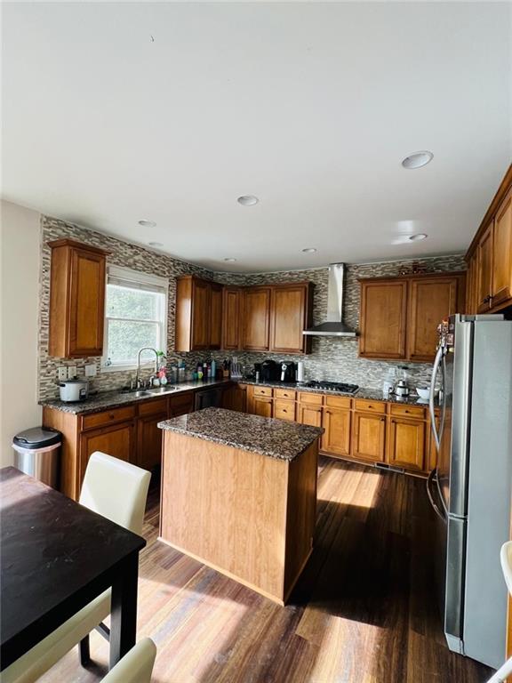 7437 Fireside Lane Flowery Branch, GA 30542 - Photo 9 of 16 a kitchen with stainless steel appliances granite countertop a refrigerator a stove top oven a sink and dishwasher