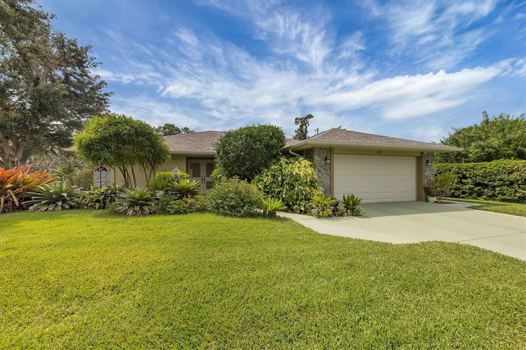 421 Urbana Road Venice, FL 34293 - Photo 1 of 1 a view of a house with a yard and garage