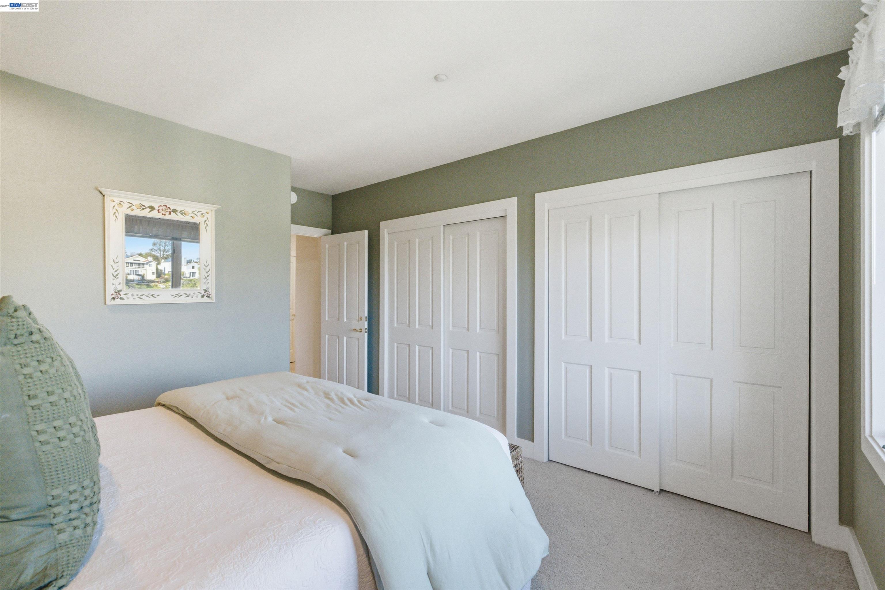 126 Frederick Street Santa Cruz, CA 95062 - Photo 17 of 60 a bedroom with a bed and a window