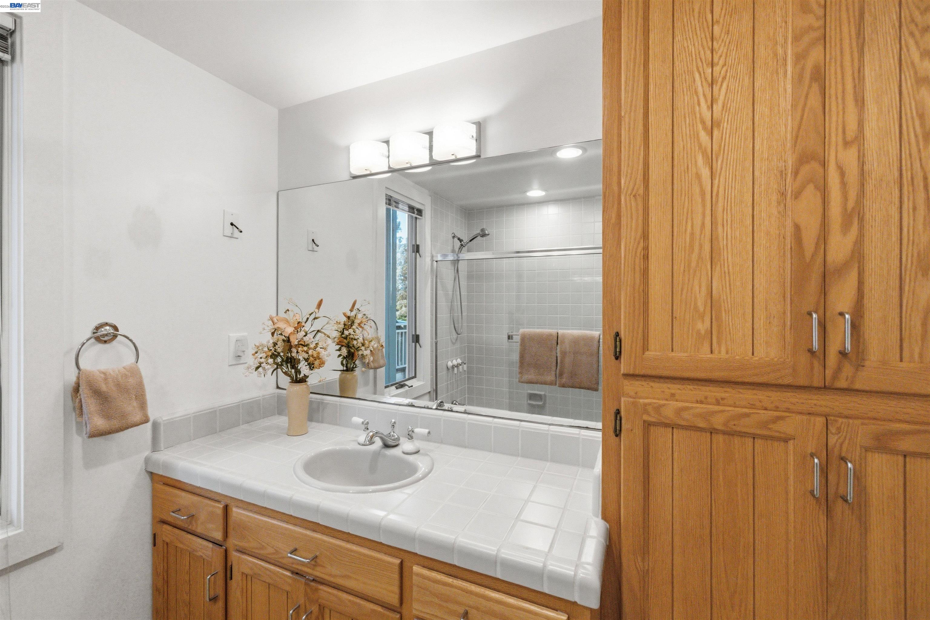 126 Frederick Street Santa Cruz, CA 95062 - Photo 18 of 60 a bathroom with a sink and a mirror