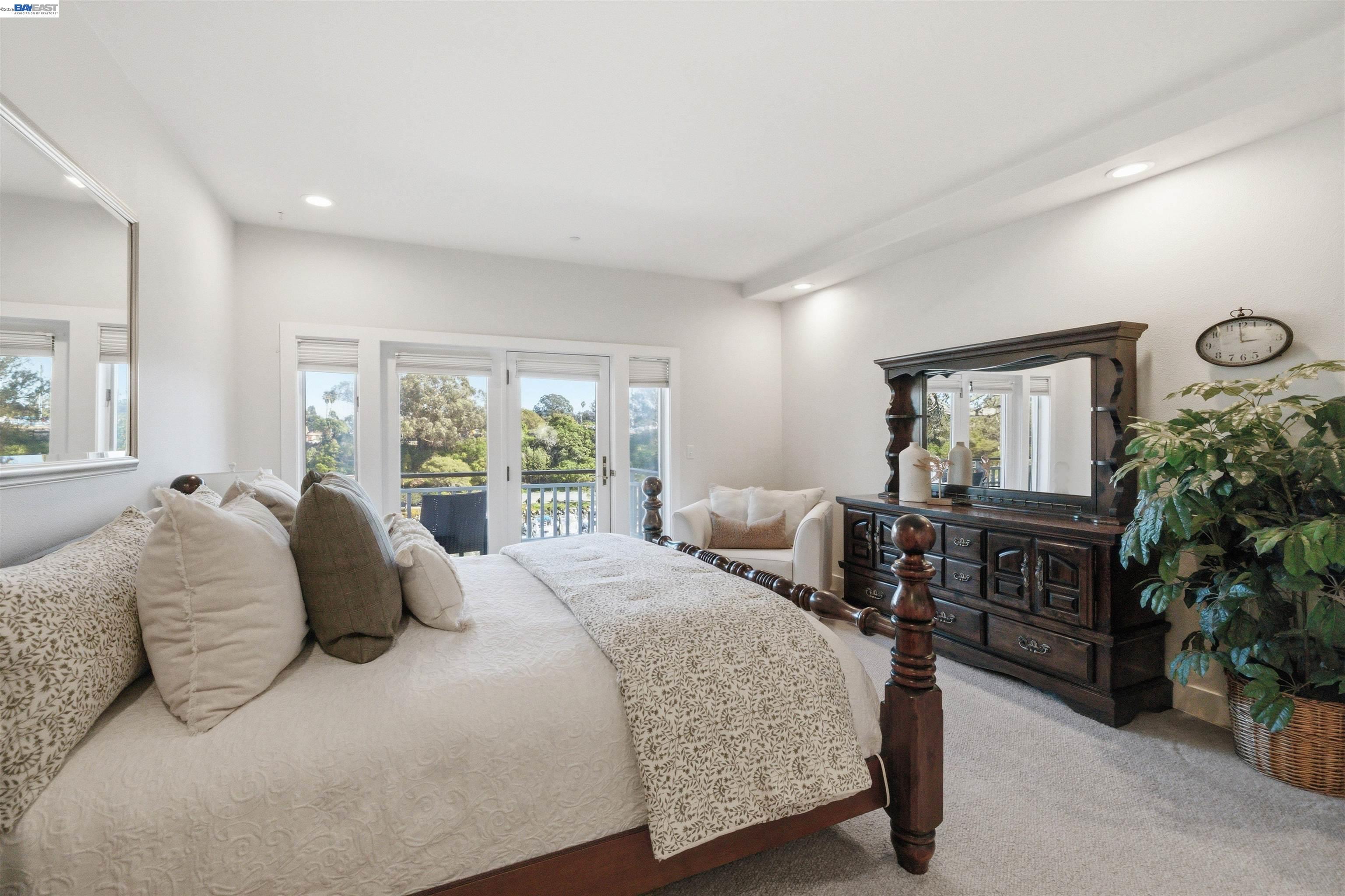 126 Frederick Street Santa Cruz, CA 95062 - Photo 20 of 60 a bedroom with a bed table flowerpot and window