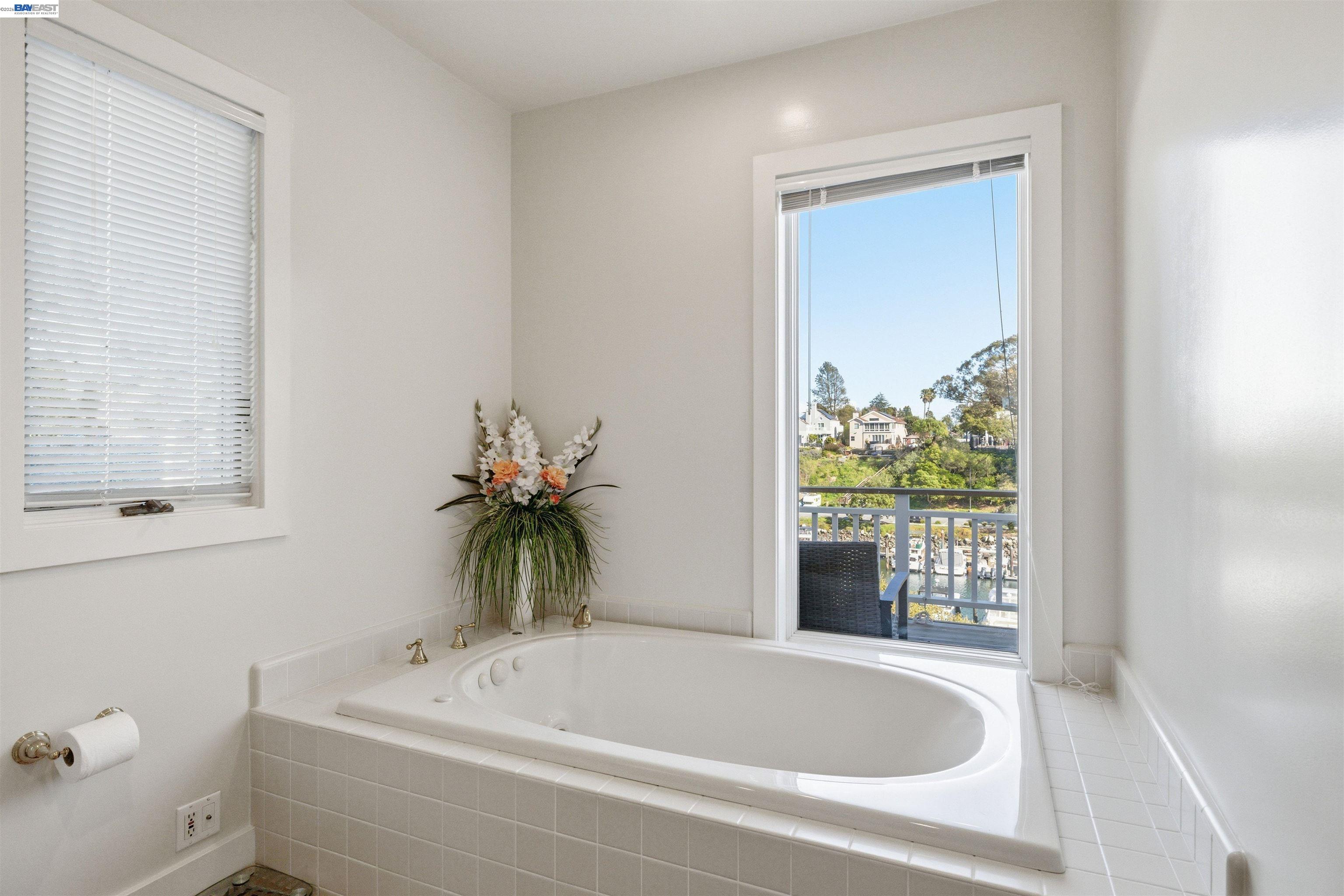 126 Frederick Street Santa Cruz, CA 95062 - Photo 23 of 60 a bathroom with a tub a sink and a window