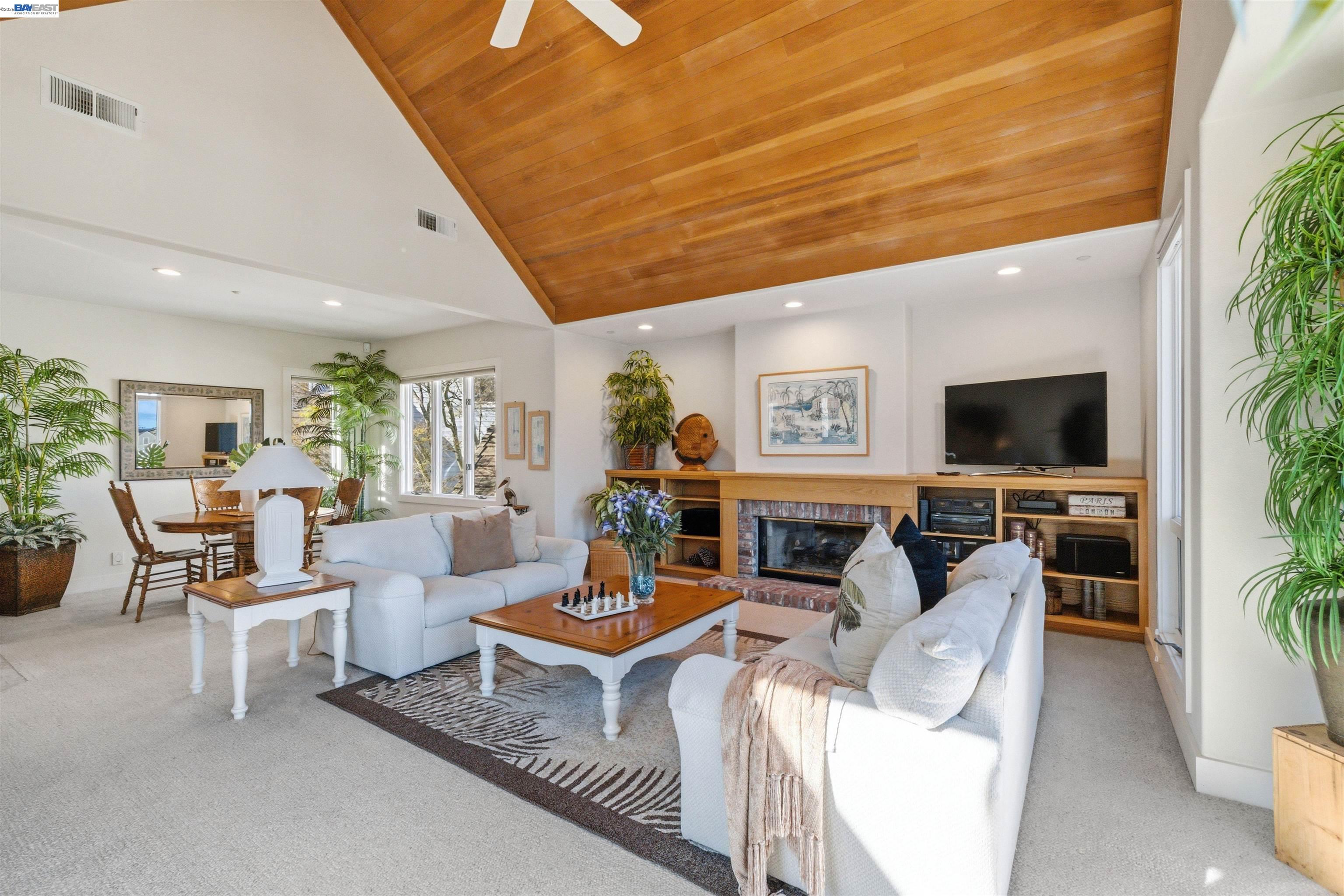 126 Frederick Street Santa Cruz, CA 95062 - Photo 3 of 60 a living room with furniture and a flat screen tv