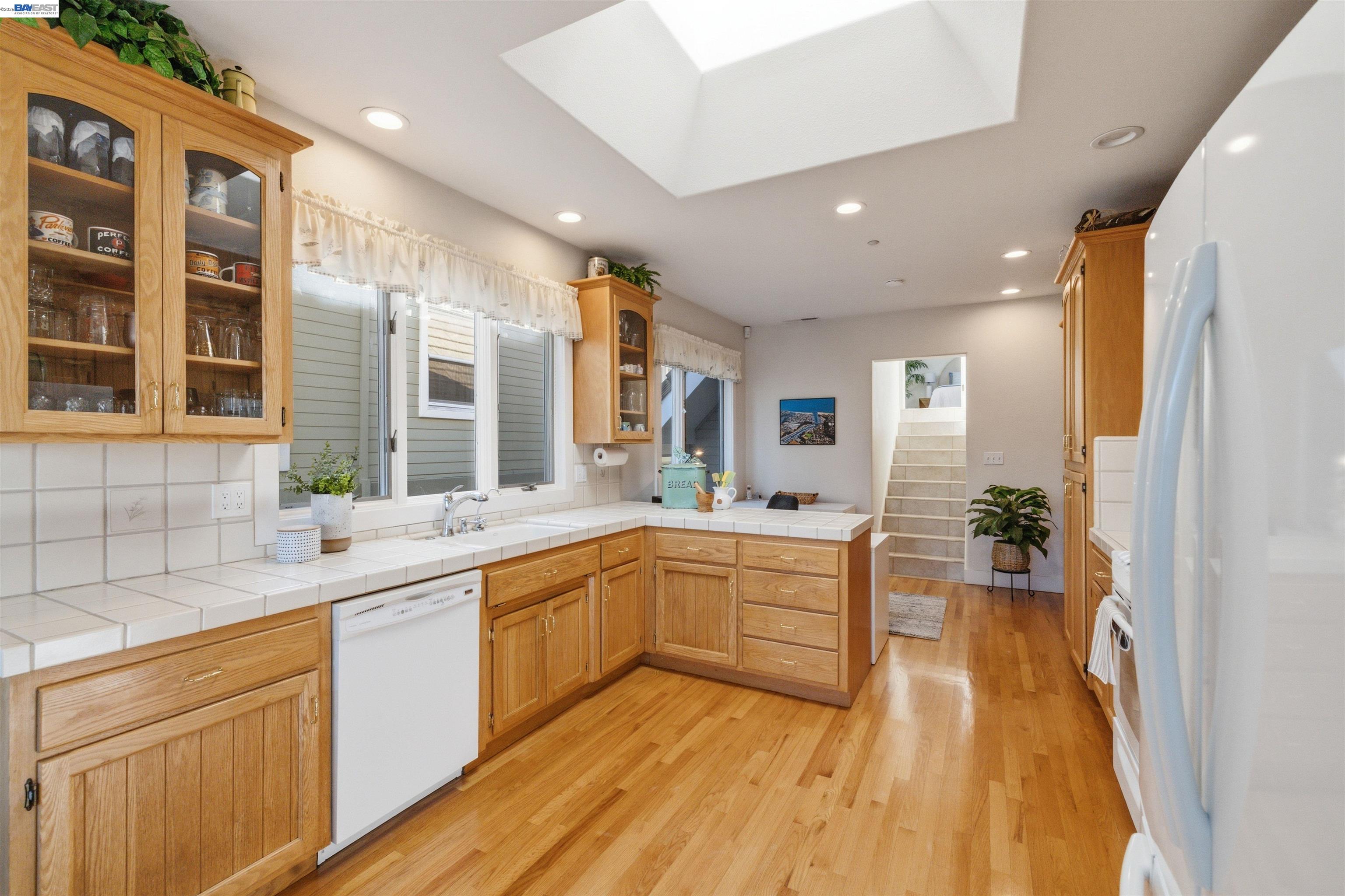 126 Frederick Street Santa Cruz, CA 95062 - Photo 9 of 60 a large white kitchen with a large window