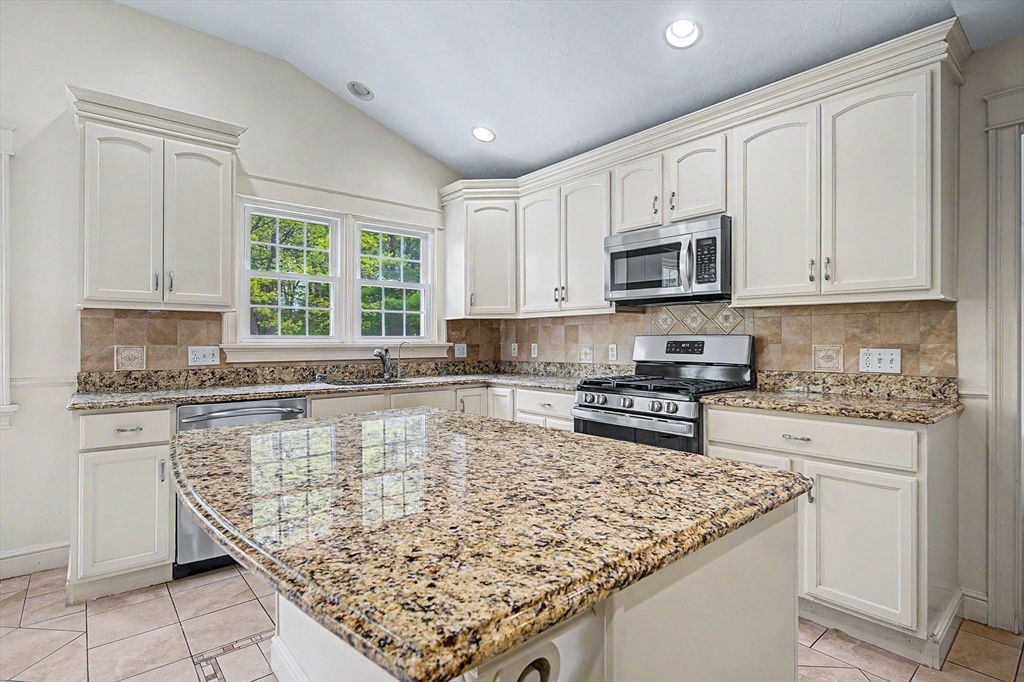 3 Oak View Terrace, Unit 3 Franklin, MA 02038 - Photo 8 of 38 a kitchen with a stove sink and cabinets