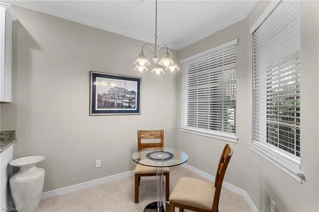 a view of a room with furniture and windows