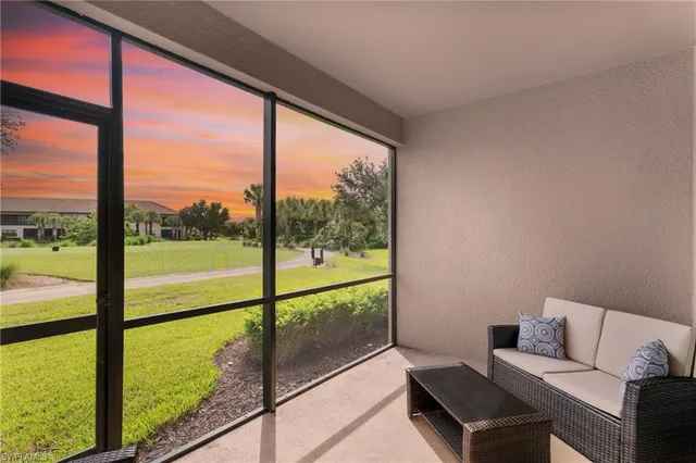 a living room with a floor to ceiling window
