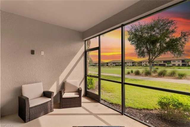 a view of swimming pool with seating space