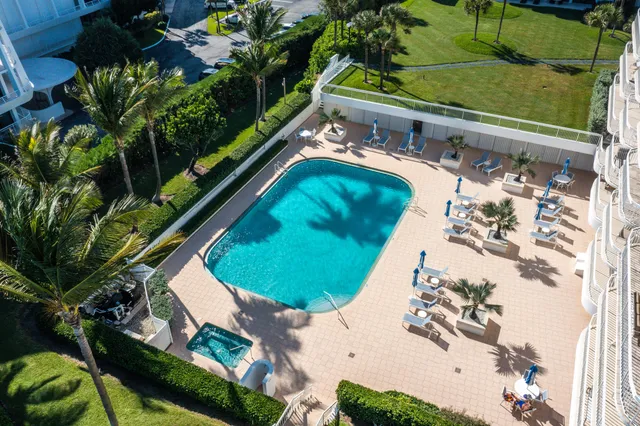 a view of swimming pool from a balcony