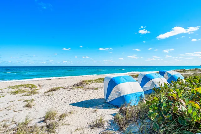 a view of water heater room with wooden floor