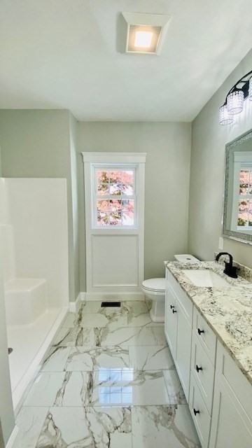 2 Touraine Street Worcester, MA 01604 - Photo 17 of 34 a spacious bathroom with a granite countertop sink a toilet and a bathtub