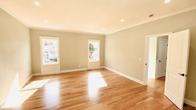 2 Touraine Street Worcester, MA 01604 - Photo 18 of 34 a view of an empty room with wooden floor and a window