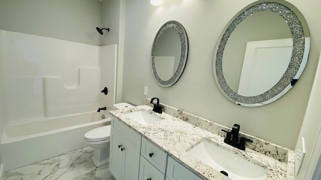 2 Touraine Street Worcester, MA 01604 - Photo 20 of 34 a bathroom with a granite countertop toilet a sink and a mirror