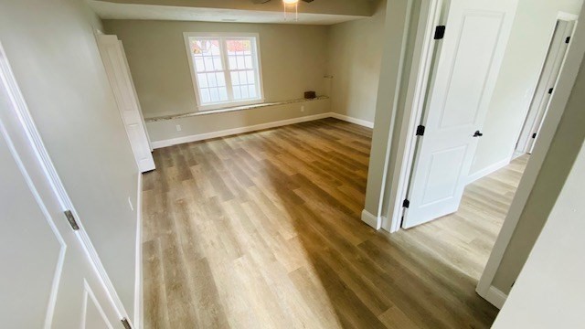 2 Touraine Street Worcester, MA 01604 - Photo 25 of 34 a view of an empty room with wooden floor and a window