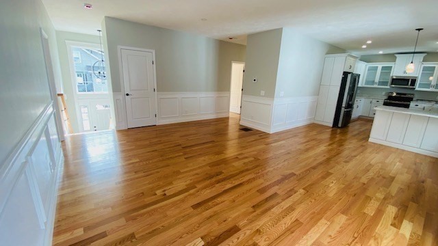 2 Touraine Street Worcester, MA 01604 - Photo 3 of 34 a view of a kitchen with a sink and a refrigerator