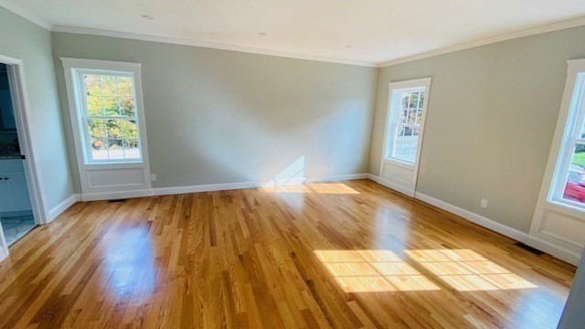 2 Touraine Street Worcester, MA 01604 - Photo 4 of 34 a view of empty room with wooden floor and fan